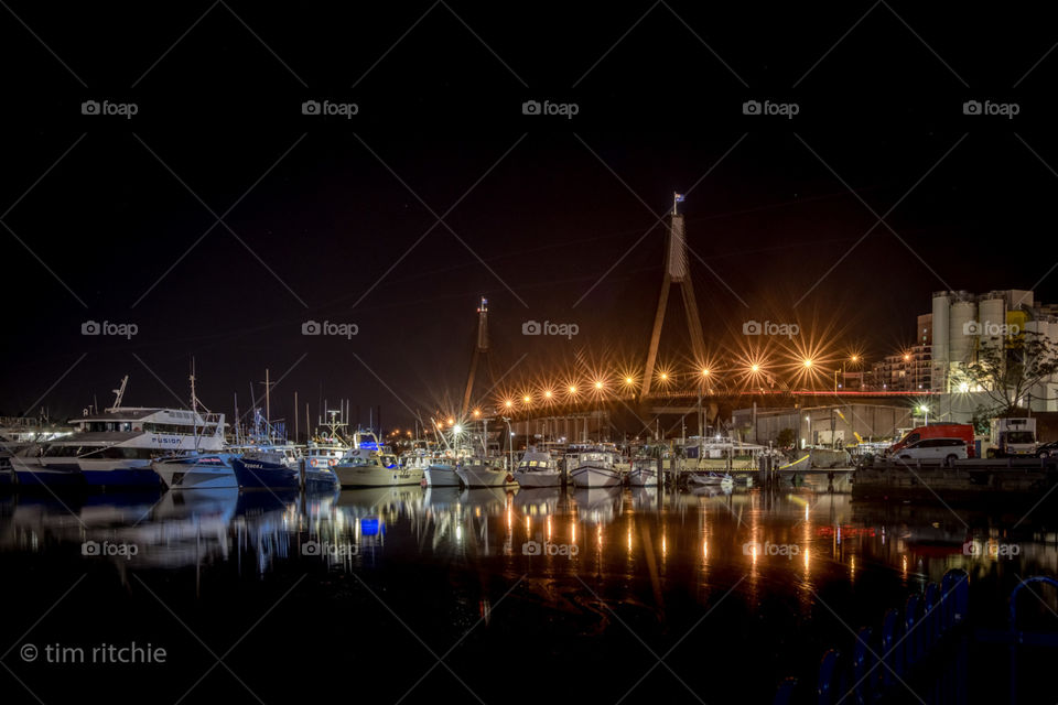 Sydney’s ANZAC Bridge and boats moored at Blackwater Bay, seen from the Fish Market