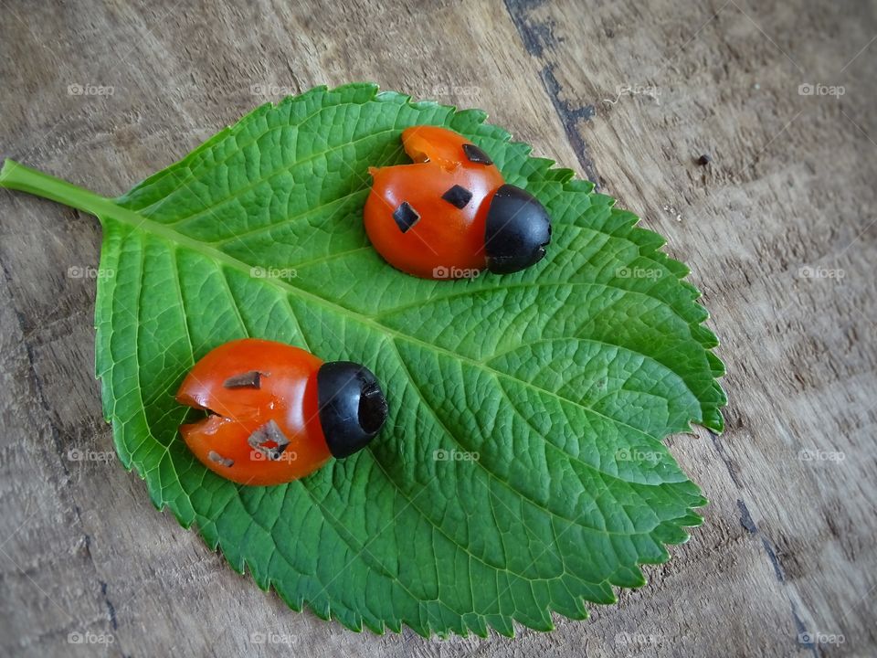 Ladybugs made of tomato and olives