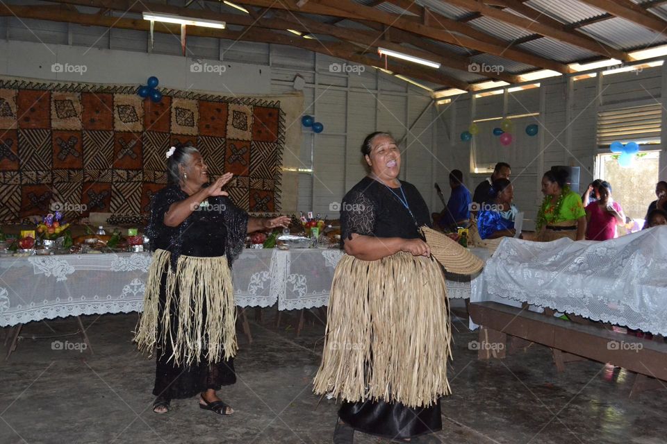 Old Tongan Woman Dancing with Friends at Party 