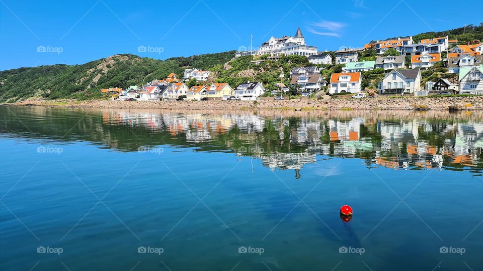View of an old hotel reflected in the water