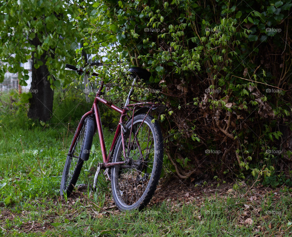 Lonely red bicycle.