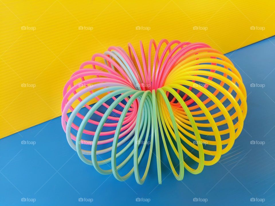 A colorful magic spring on blue and yellow background.