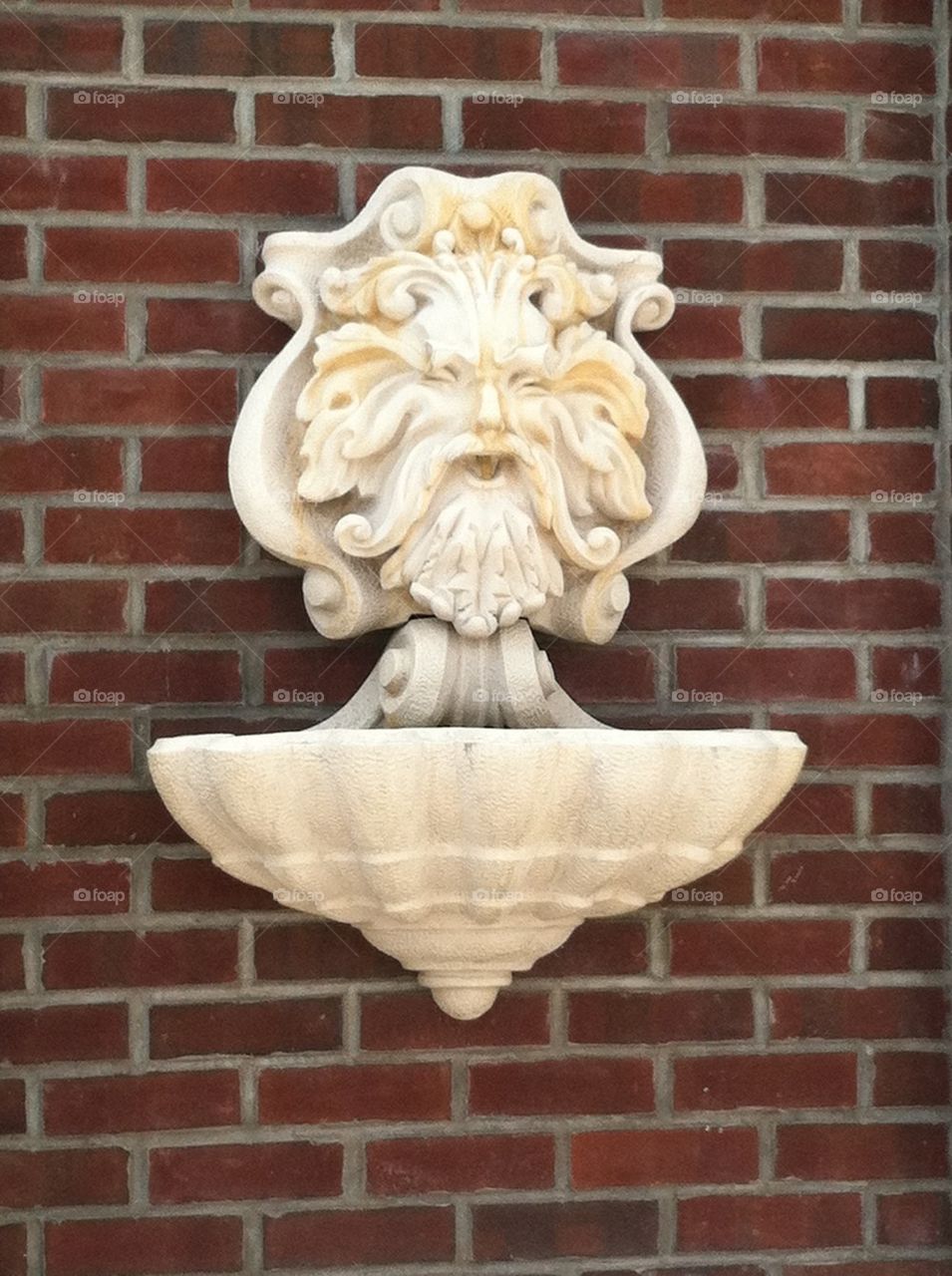 Old man winter blowing wind water fountain