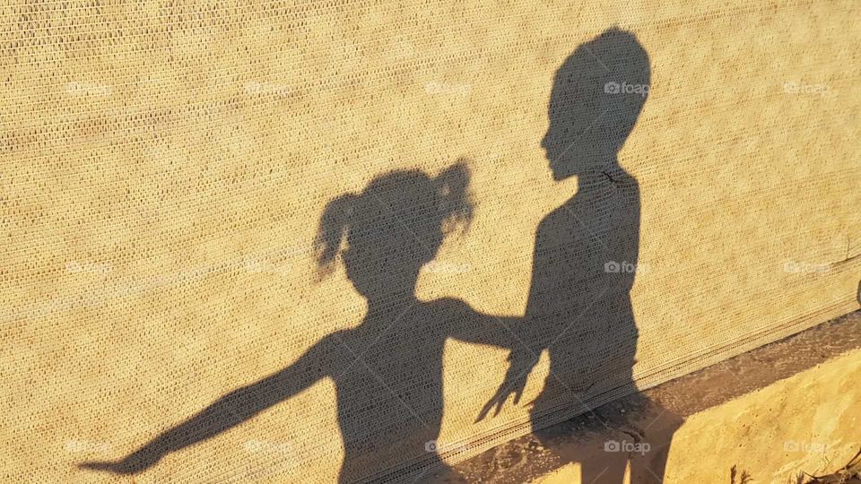 Shadow of playing babies