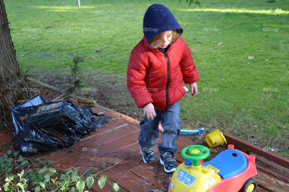 Playing in the back yard.  Boy playing on the back yard on a beautiful spring day in British Columbia 