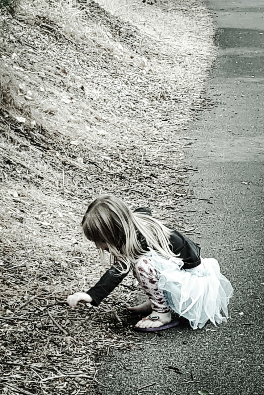 Child Inspecting Nature