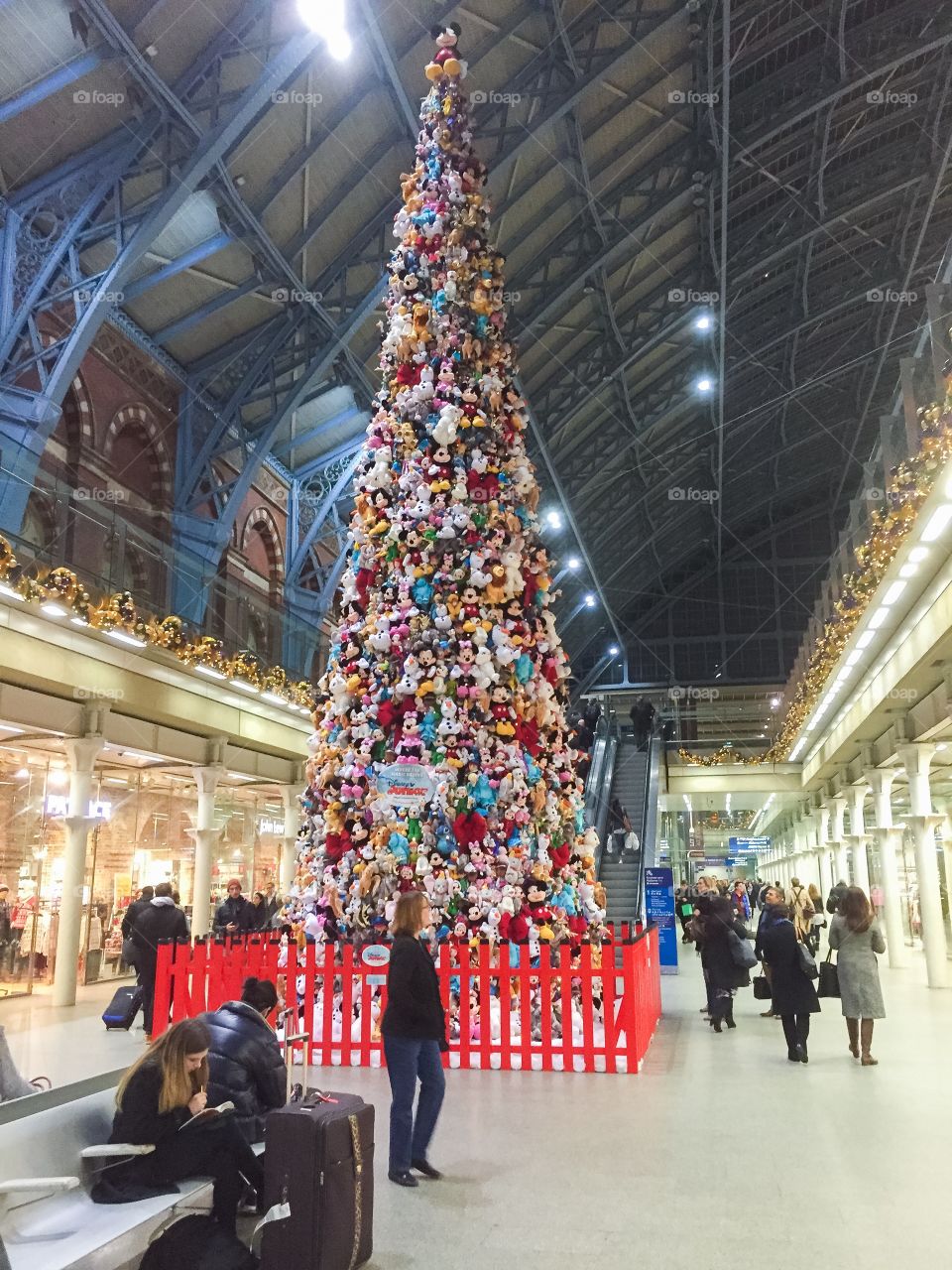 A big traditional christmas tree at Kings Cross st. Pancras in London.