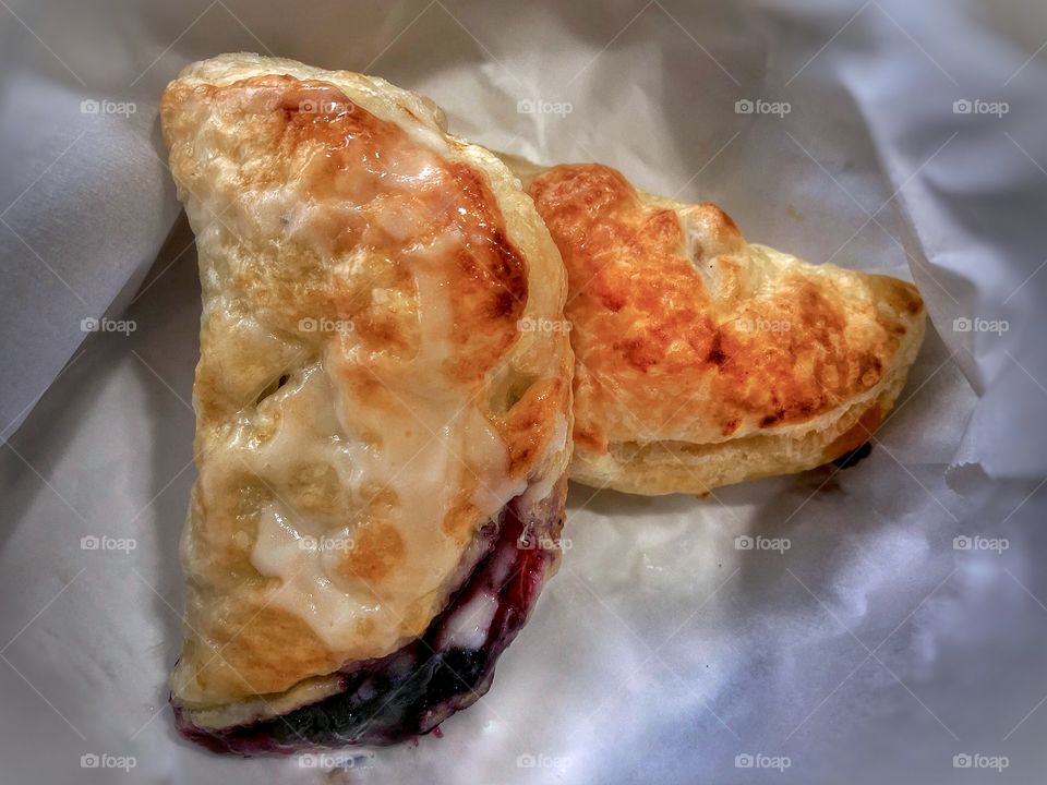 Puff Pastries (Left: Blueberry with glaze. Right: Apple Cinnamon with sharp cheddar cheese, melted, with a very light glaze. Made 3 of each.