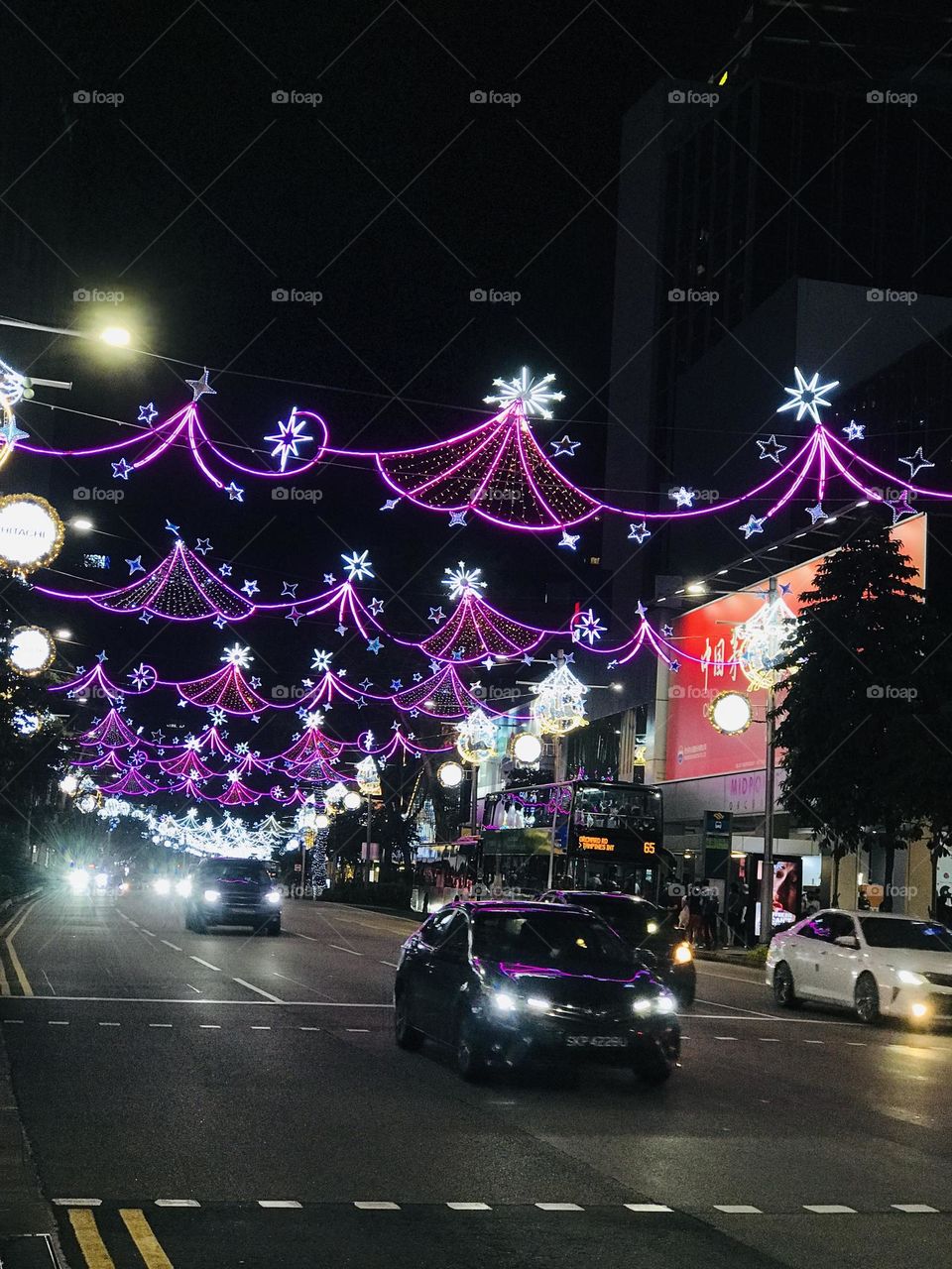 Magenta colour street lighting decoration for Christmas on road