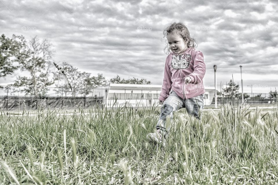 Girl walking in field