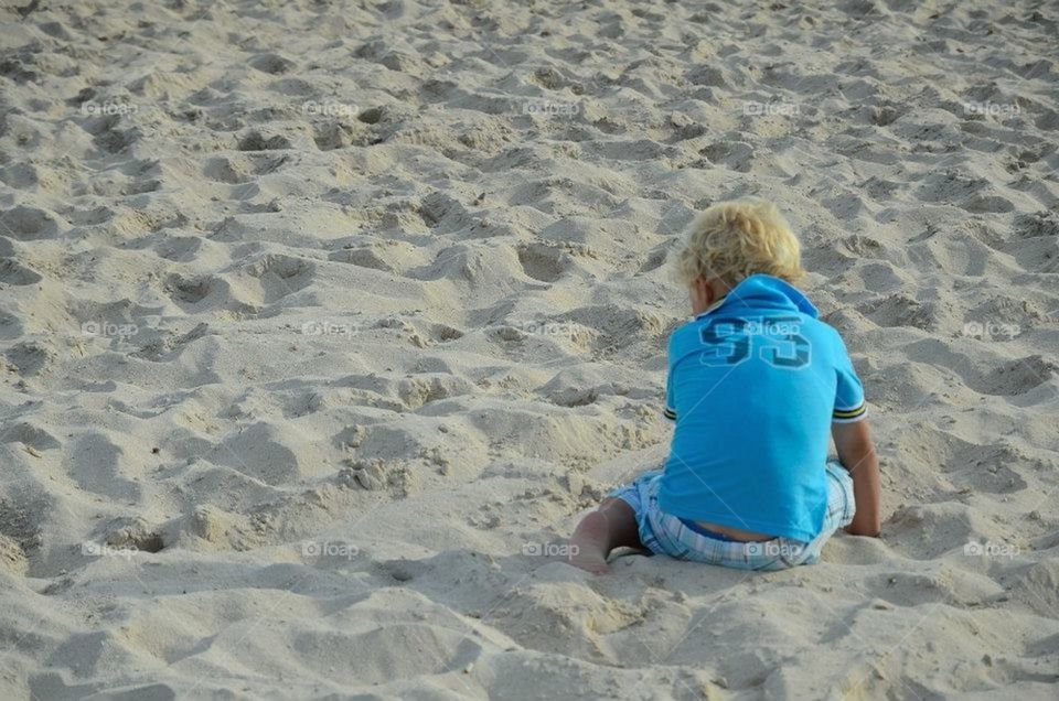 Boy in sand