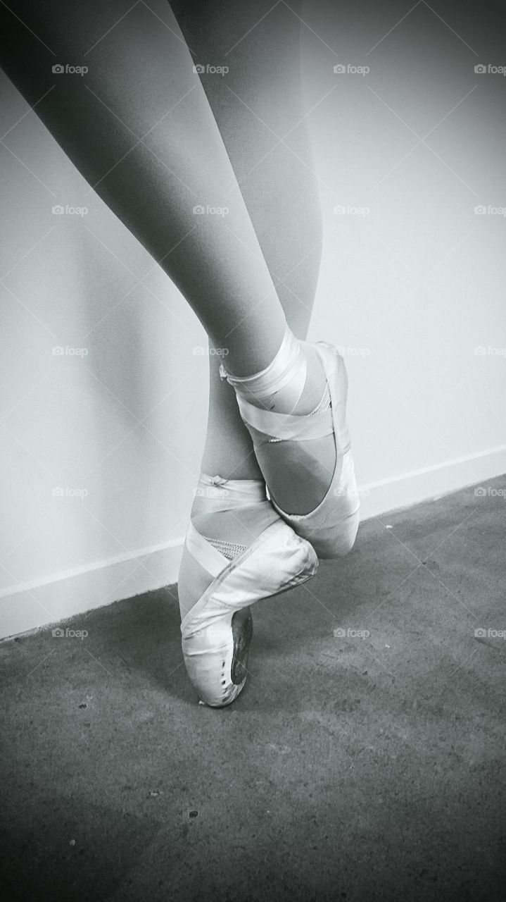 Legs of ballerina in ballet shoes