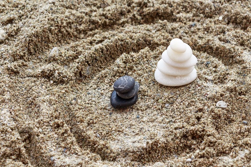 Black and white stones on the beach - Zen balance