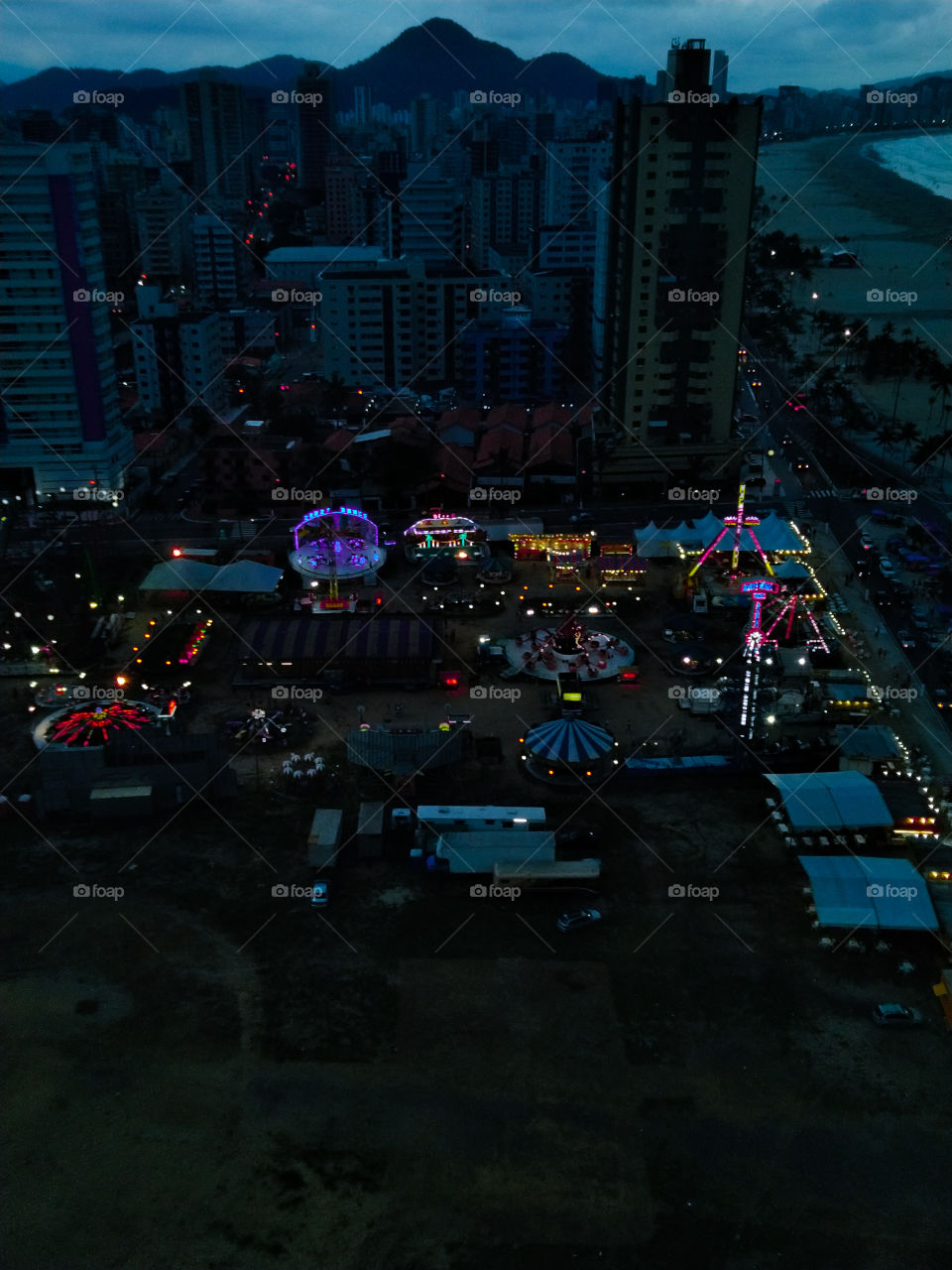 amusement park playground, evening lights
