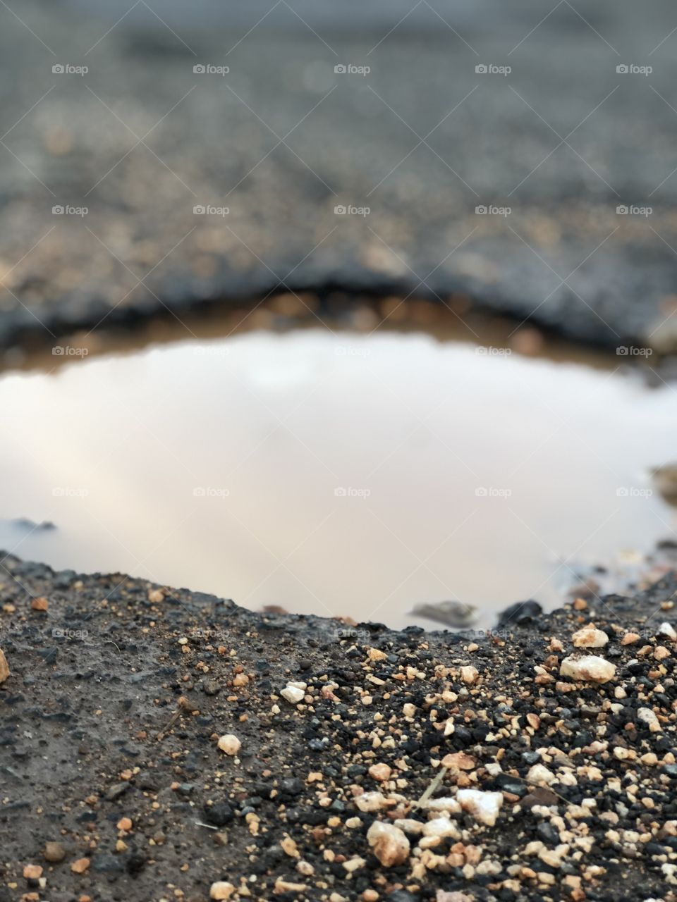 A hole in the pavement. 