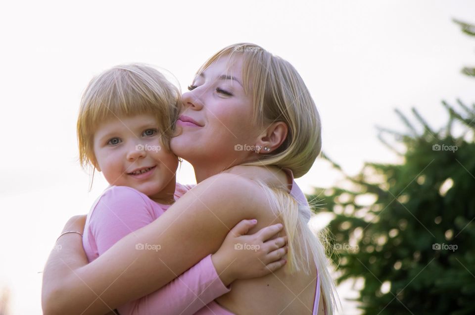Mom hugging her daughter