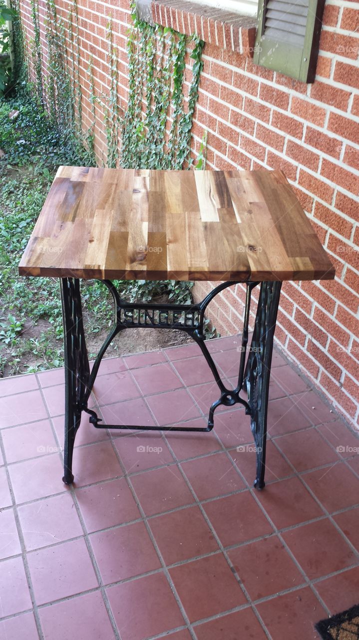 repurposed singer sewing machi. My friend wanted me to sell her antique sewing machine.  Well, it didn't, so I repurposed it into a nice table.