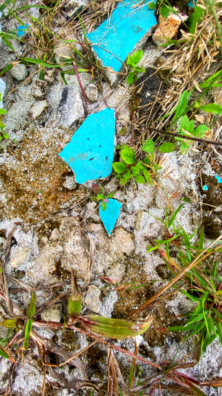 Blue broken wall on the ground