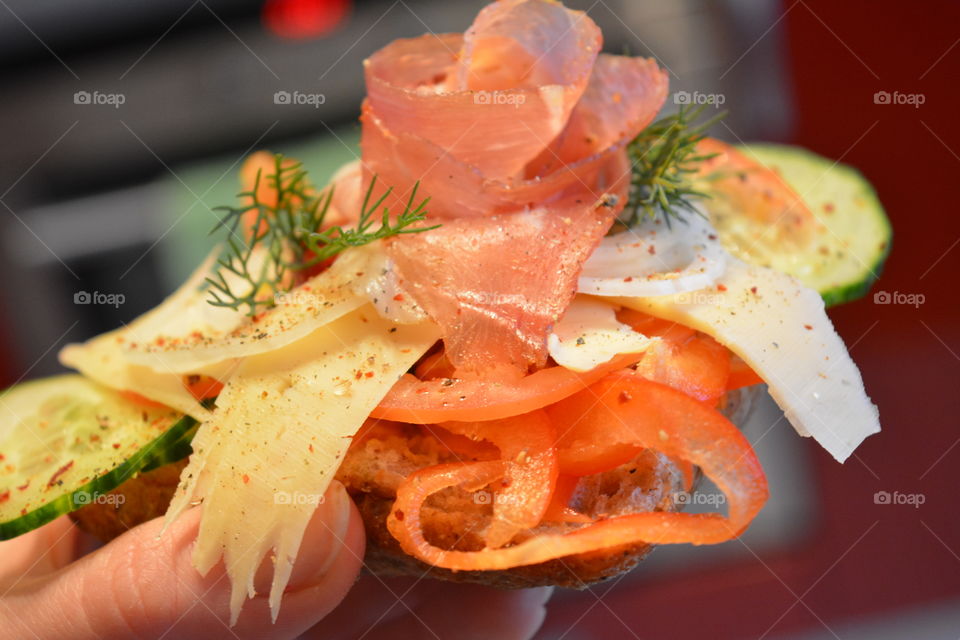 Person holding french food