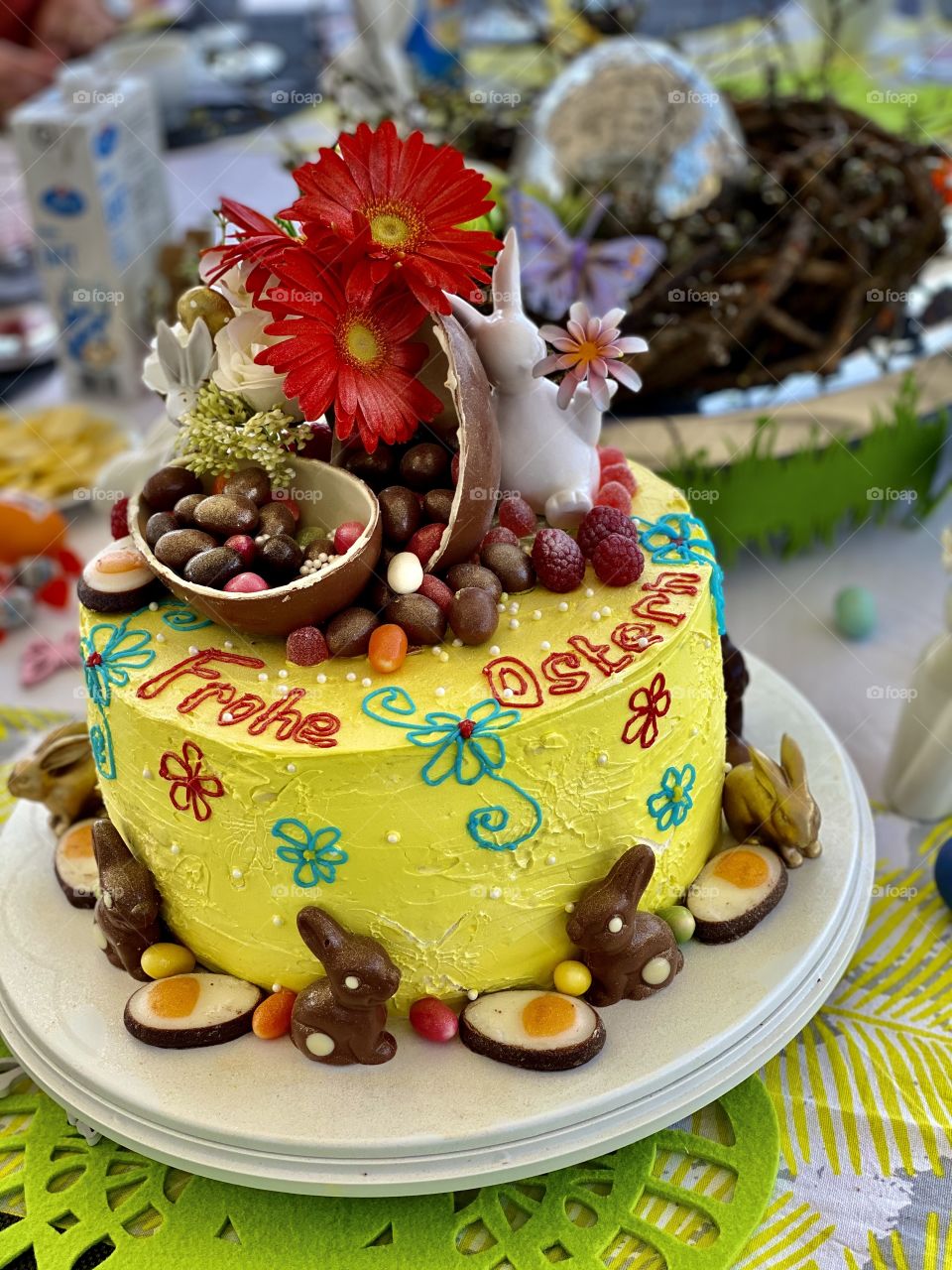 birthday cake for Easter, eggs, sweets, chocolate, flowers, decorated table for the holiday