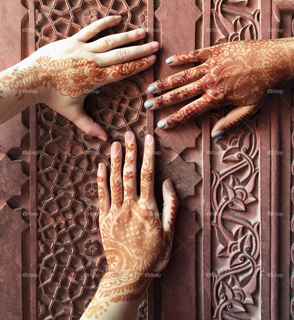 Close up of mehndi on hands