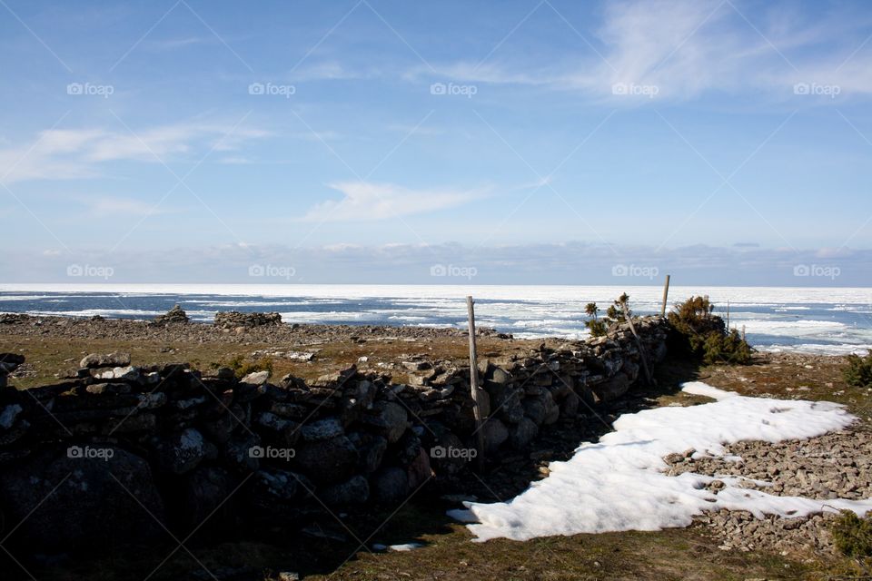 Stone wall into the sea
