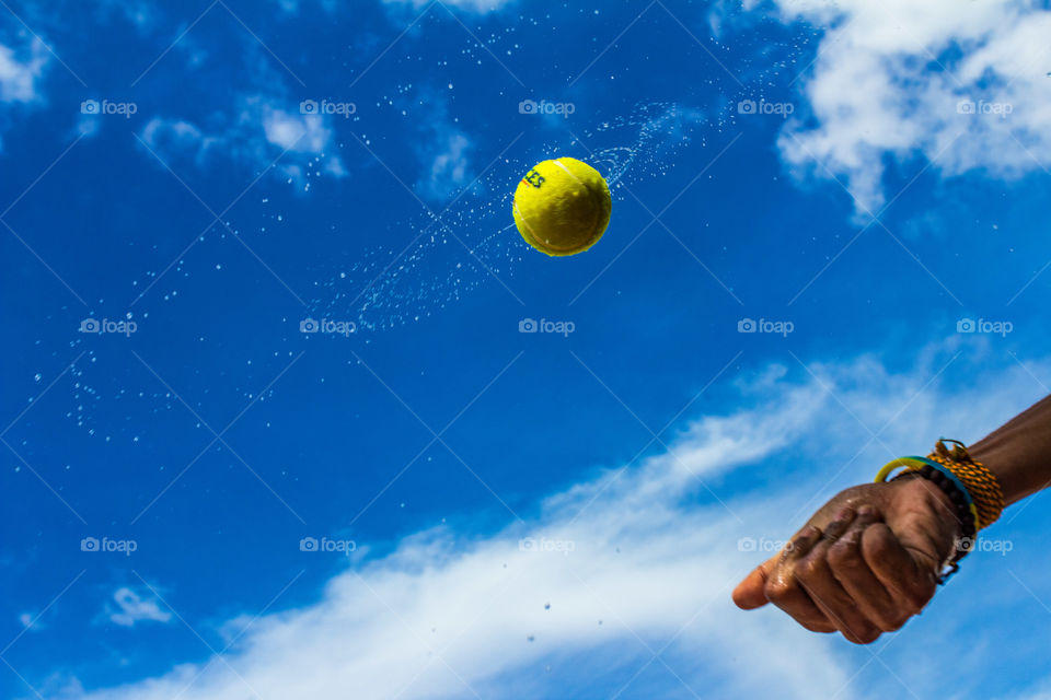 Close-up of human hand playing tennis