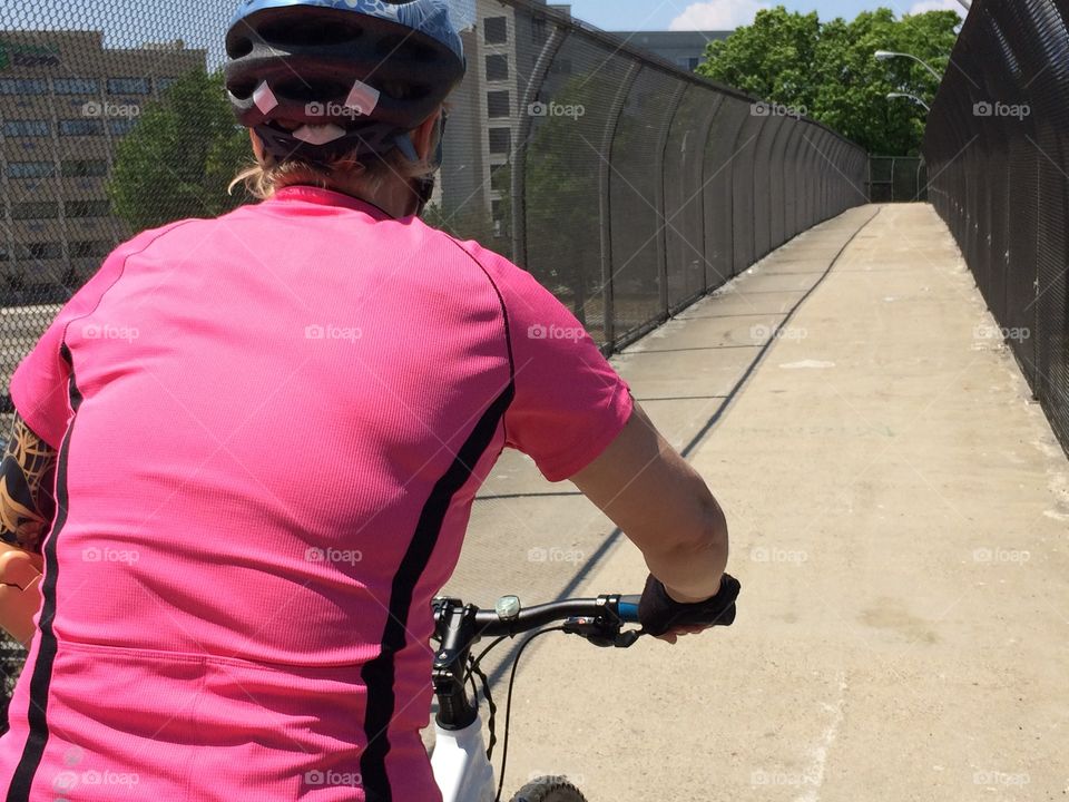 Me riding to park. Woman biking on overpass to flushing meadow park