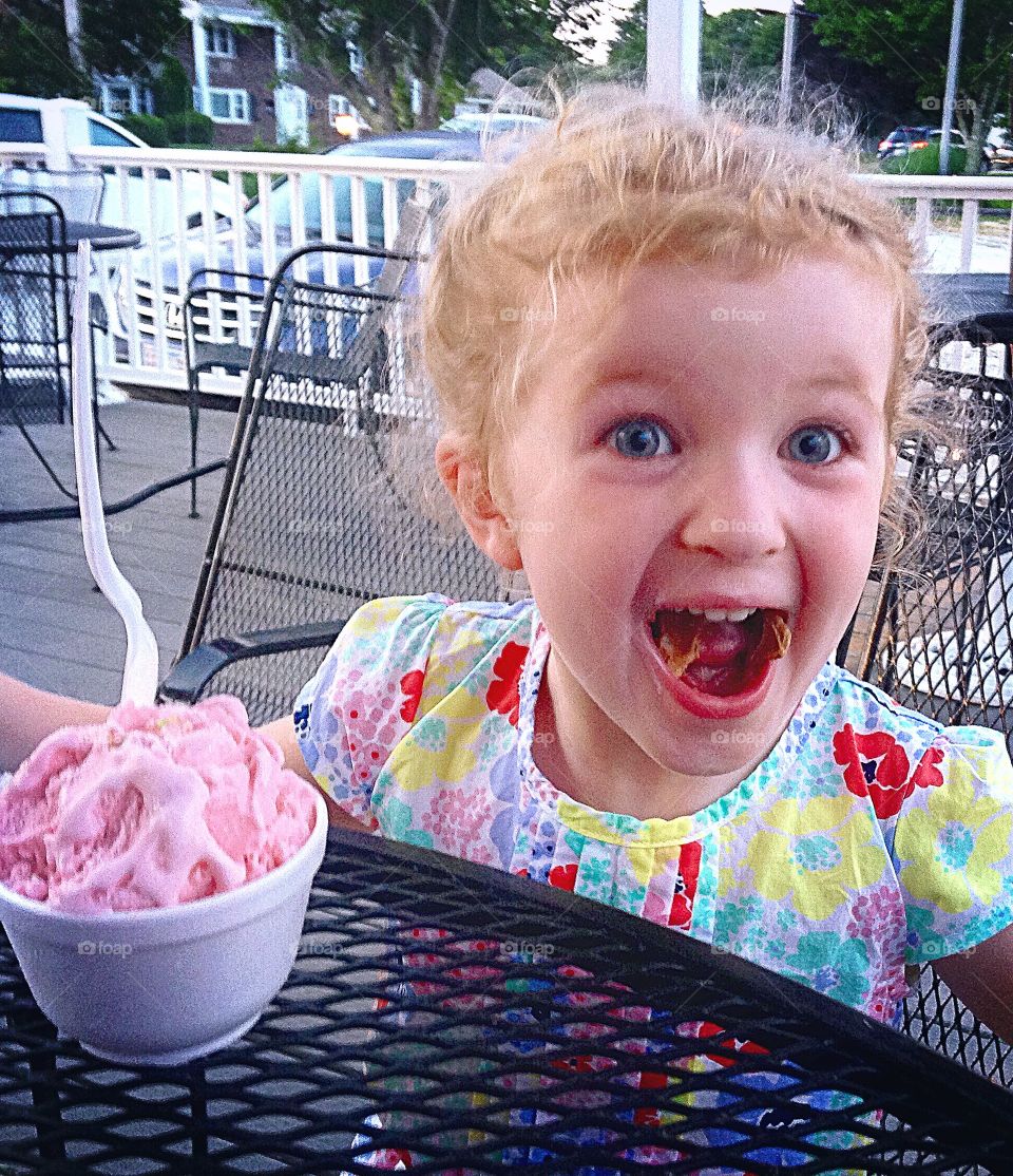 Cute girl eating ice cream