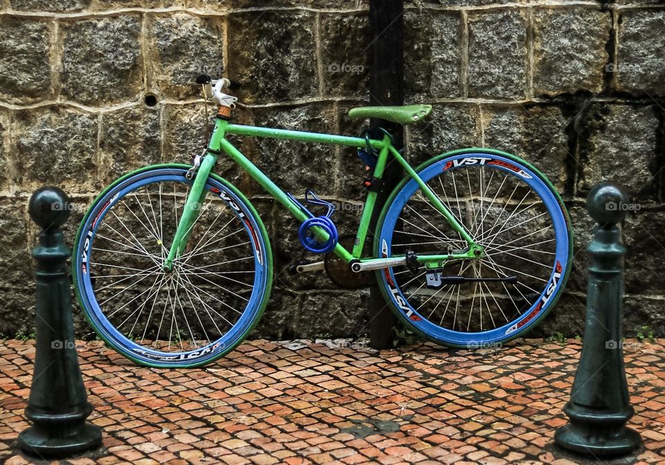 Vibrant color bicycle against the wall