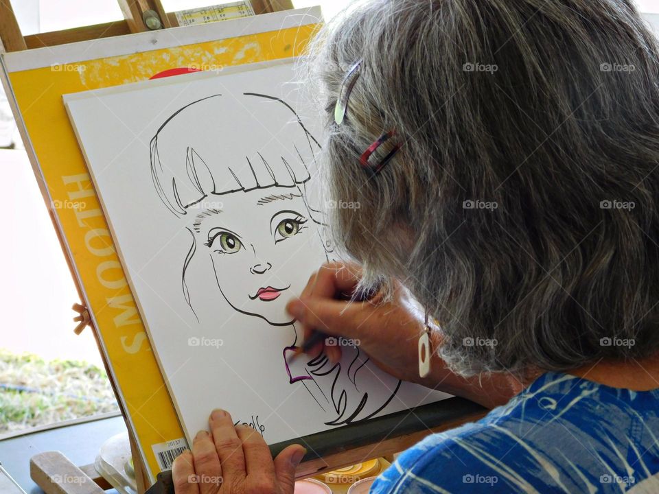 Life is Motion and Motion is Life - A caricature cartoonist draws a caricature of a girl