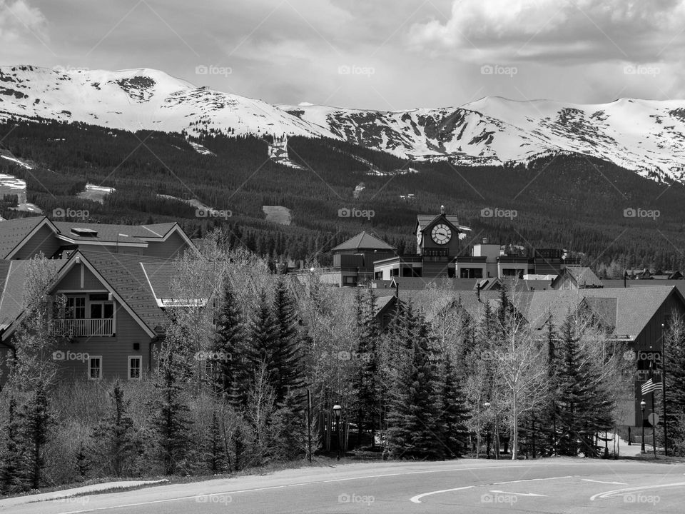 Beautiful Breckenridge Colorado on a June day with the snow capped peaks looming in the background
