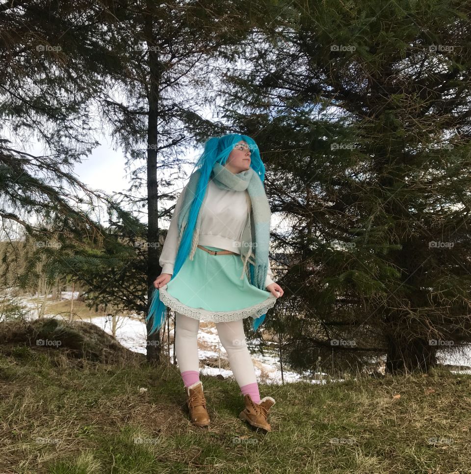 Hatsune Miku infront of some trees.