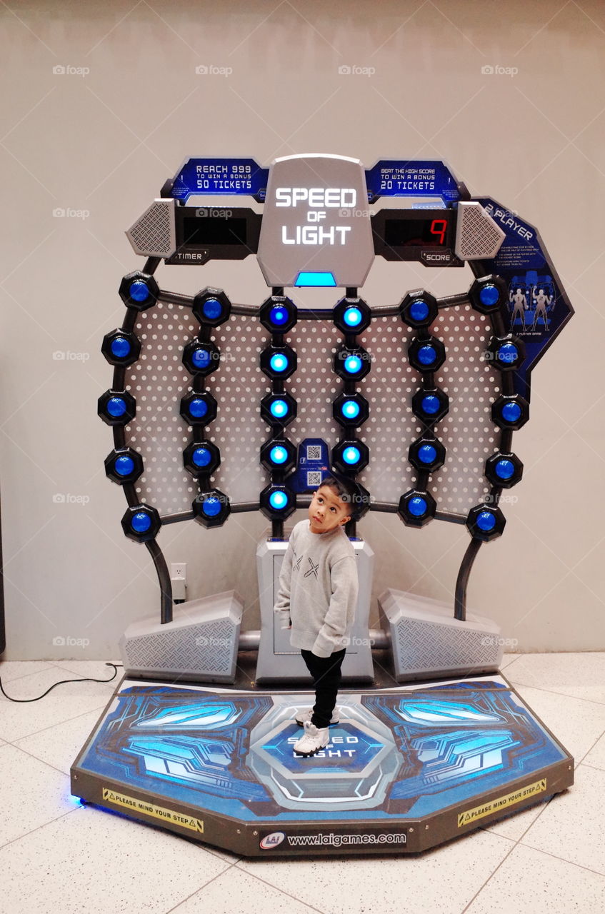 at the arcades playing