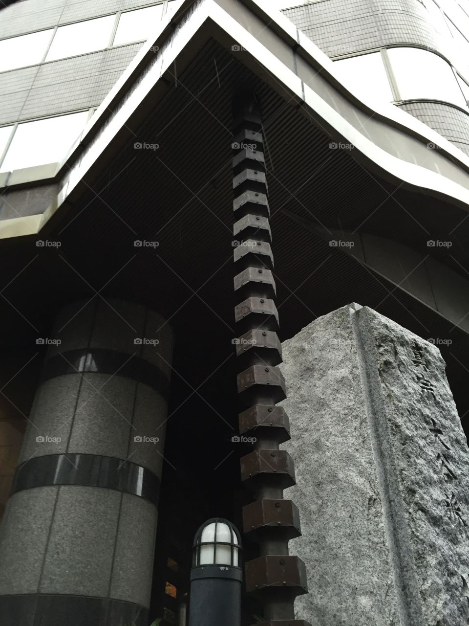 Rain gutter in Tokyo, Japan. Rain gutters are designed to trickle down each level.
