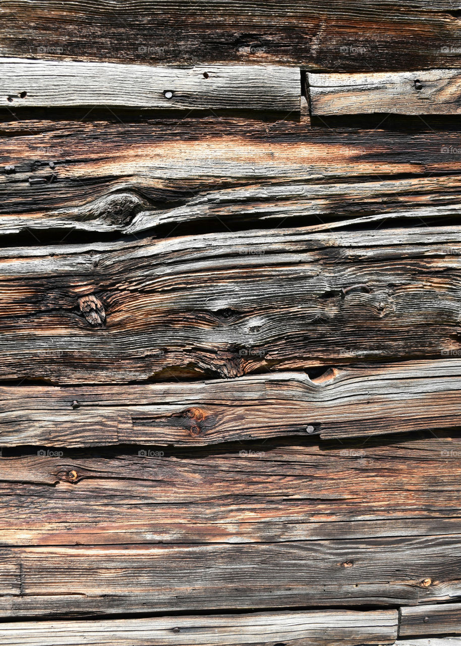 Close up of wood grain texture on side of old log cabin