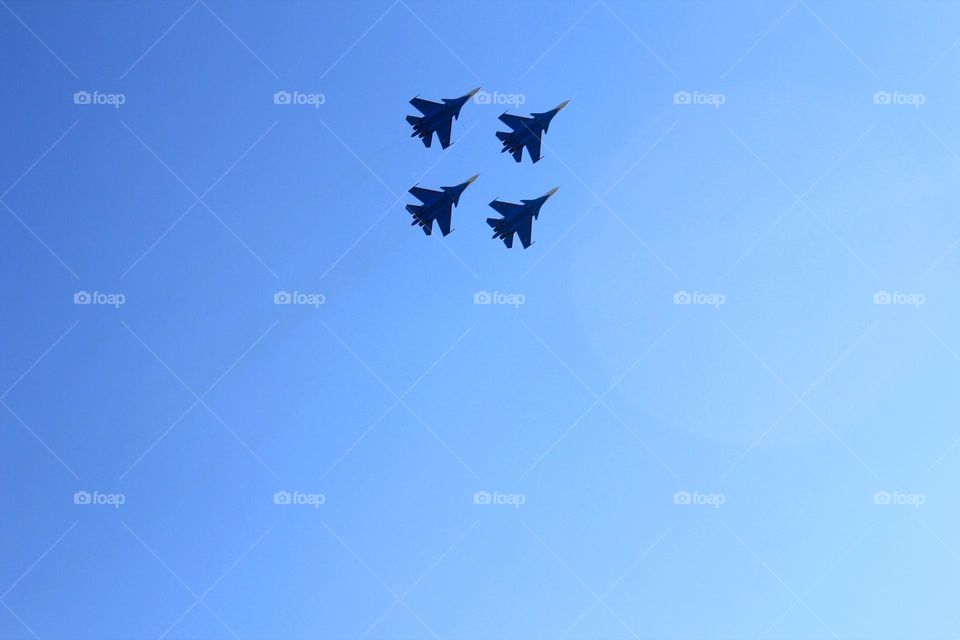 at an airshow, jet airplanes