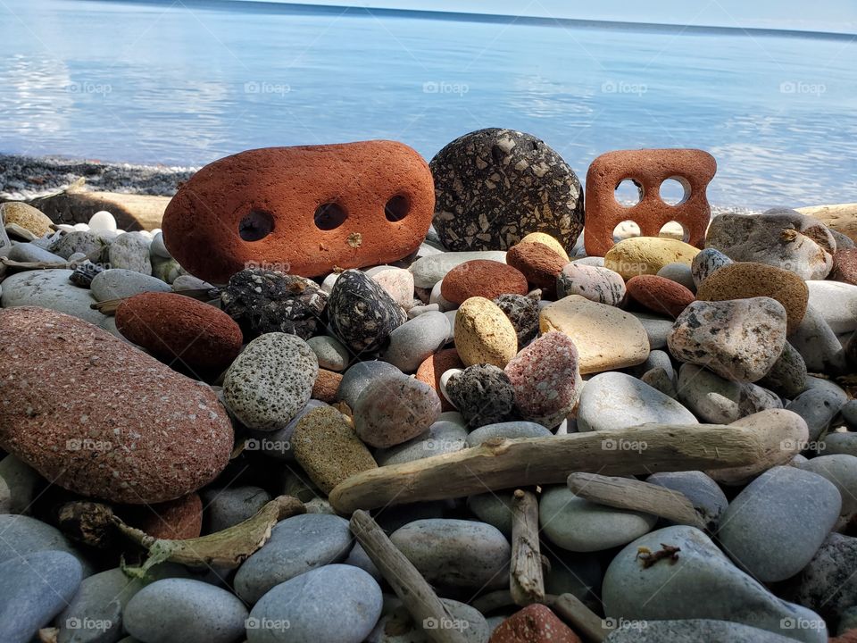 rocks ,dried stems and placid lake