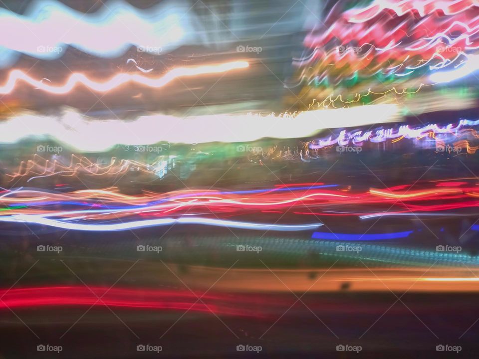 City night lights perspective blurred by high speed of the car. Abstract City night lights. Background and texture.