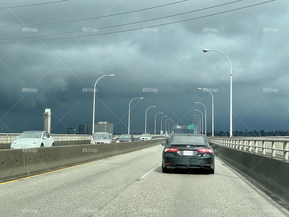 Car drivers via bridge 