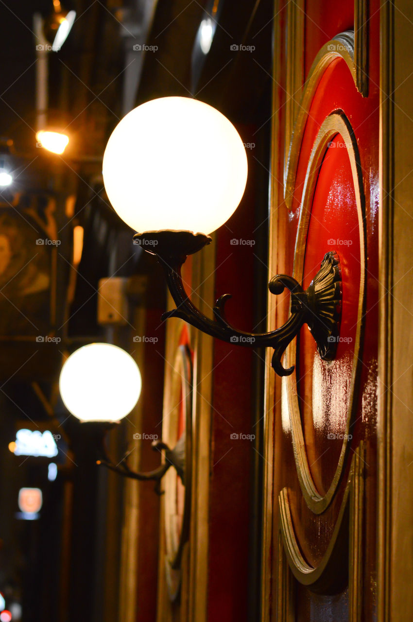 citylight, lantern, old vintage lamp on the facade in night city