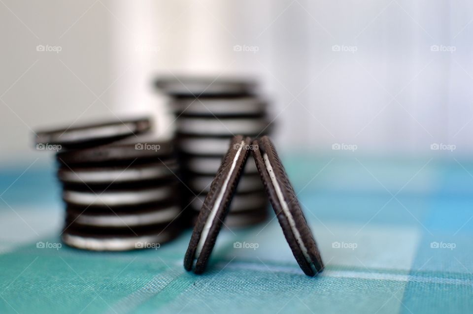 Oreo cookie thins on a white and light blue background 