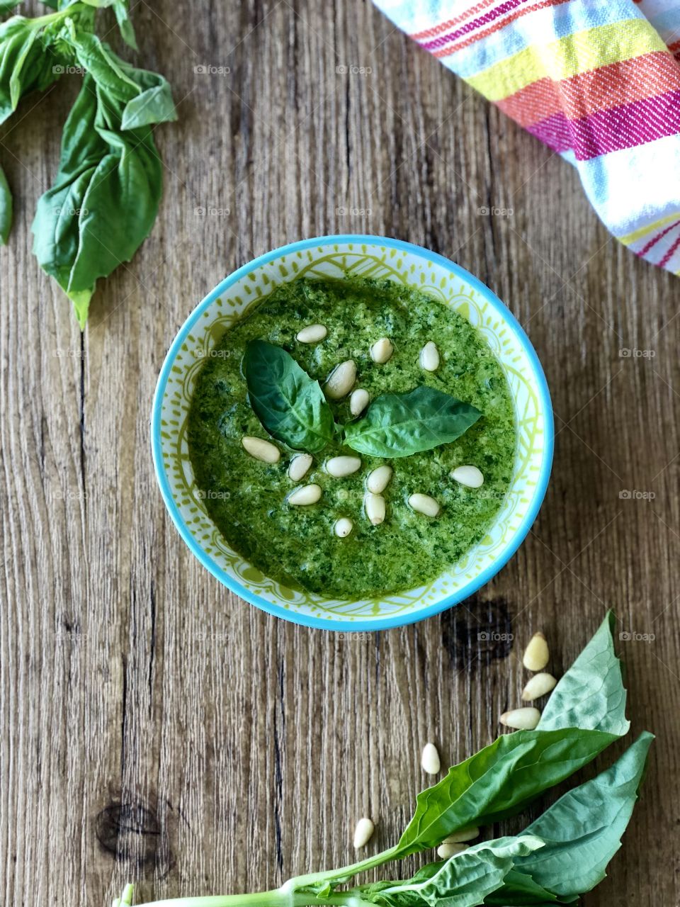 Vibrant green basil pesto, topped with crunchy pine nuts and fresh basil. The perfect healthy, seasonal dressing. 