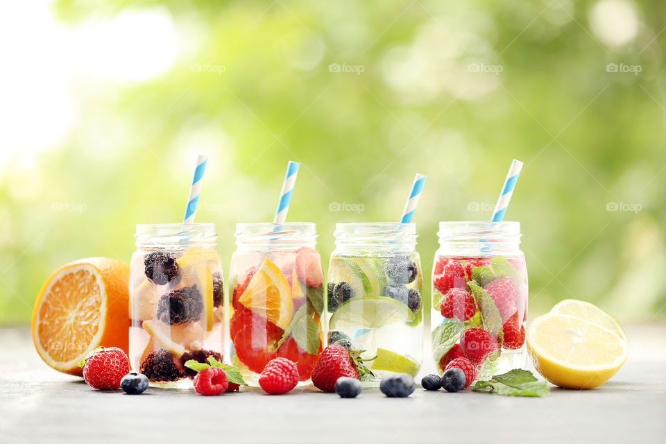 Summer time. Fresh water with berries