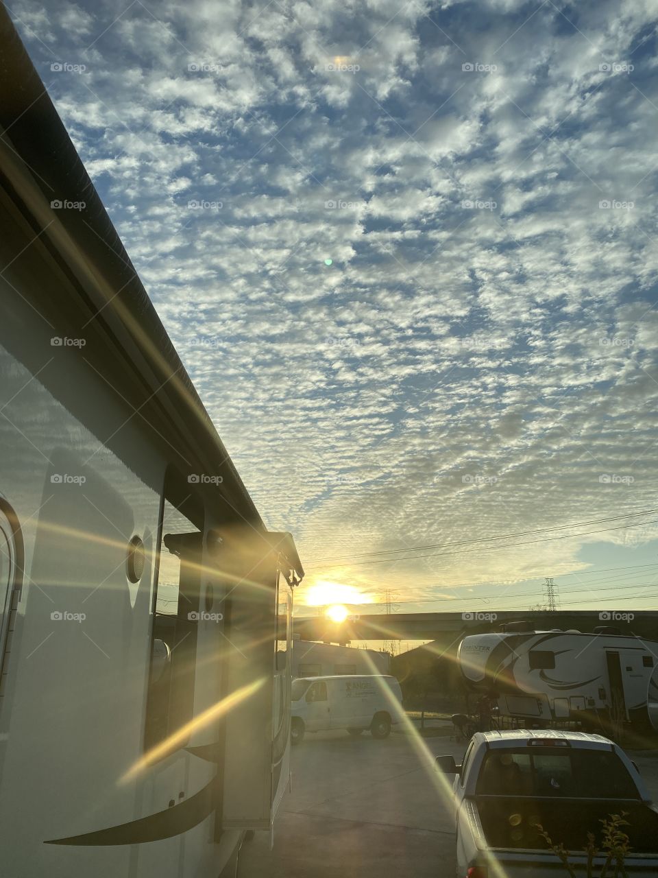 After the Crack of Dawn the Sun struggled to appear but after watching the Horizon the Sun finally peaked underneath the Cloud Bank.