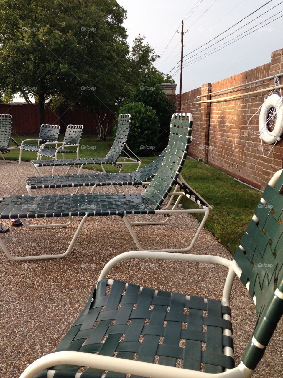 Hurry up, summer!. Empty pool chairs