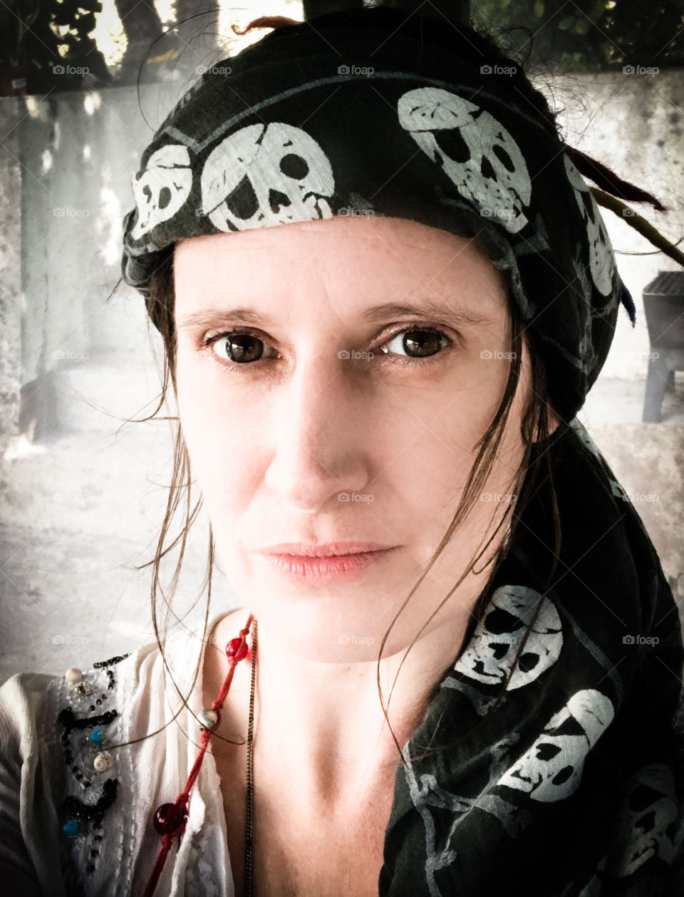 Portrait of a woman wearing a pirate bandana 