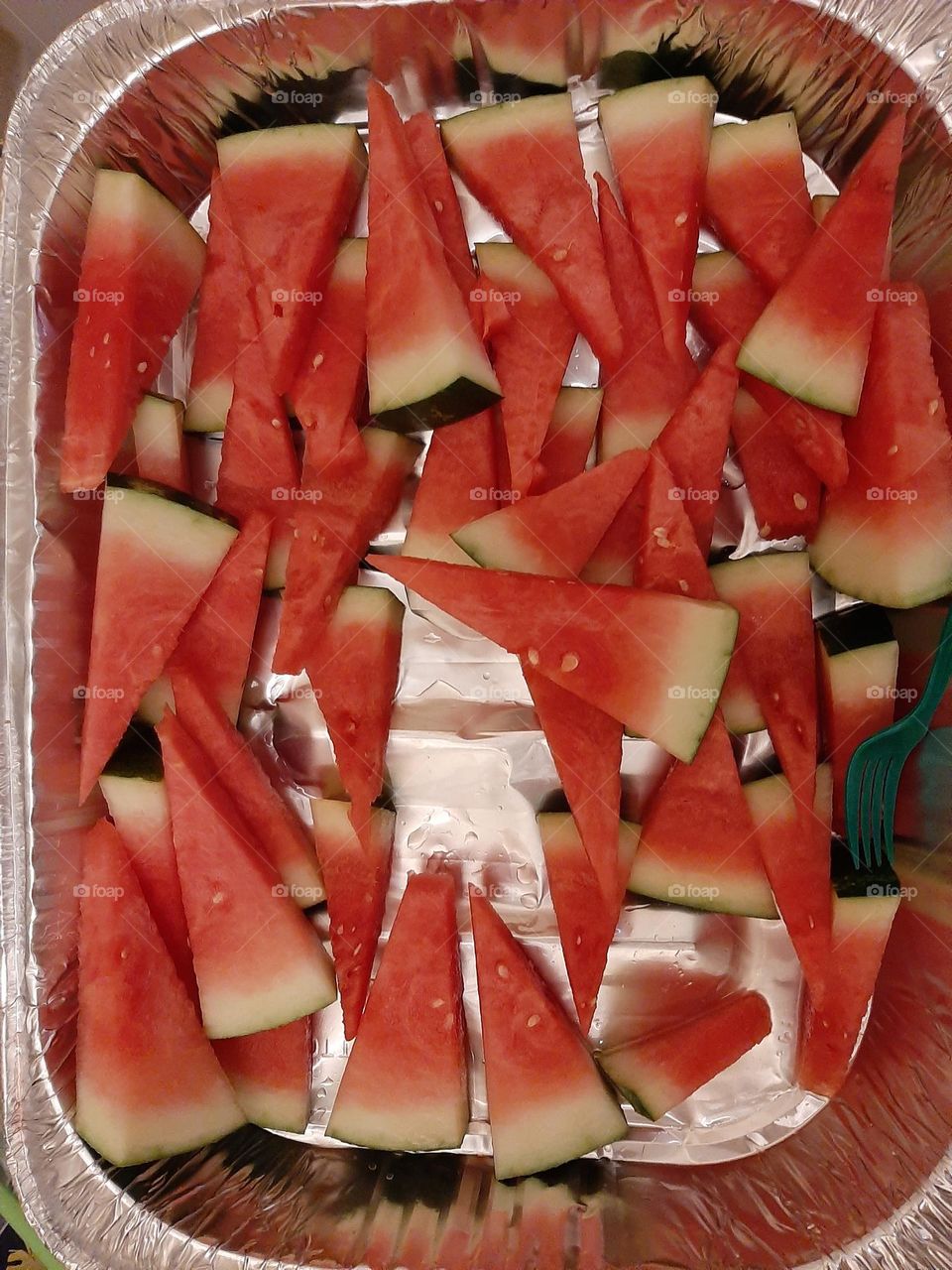 Watermelon cut in triangles juice pieces on display.