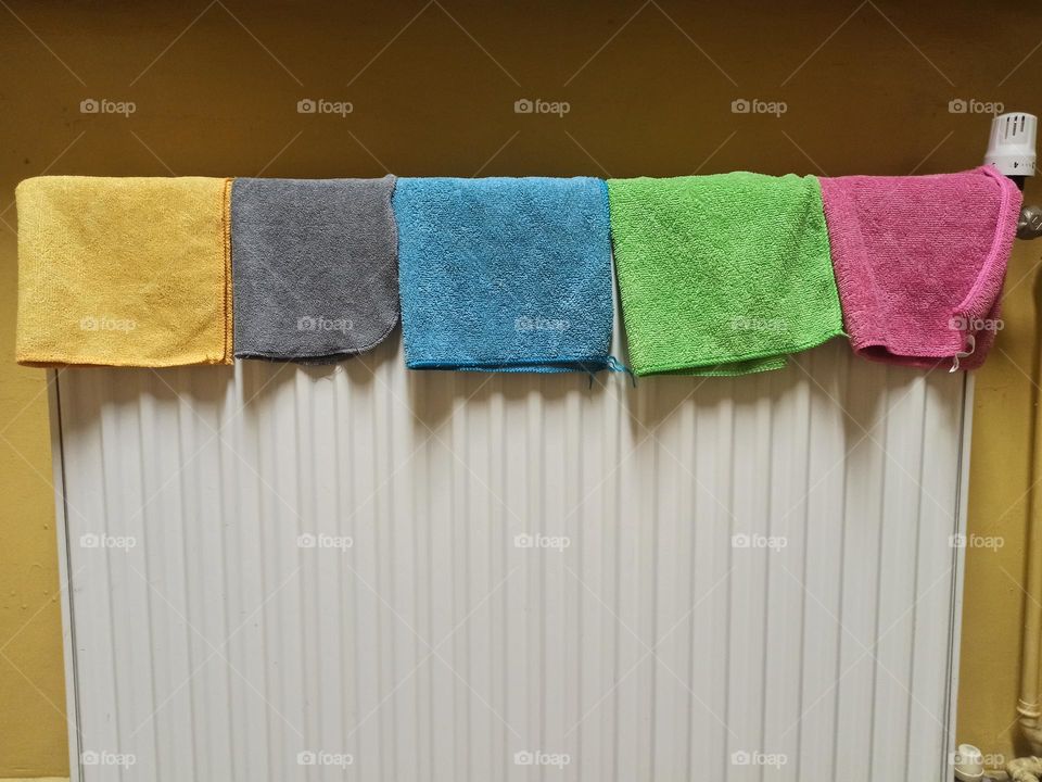 Colorful cloths on the radiator