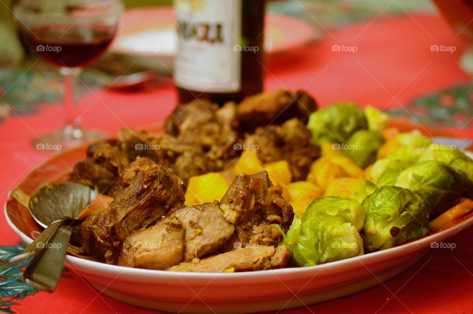 Roast lamb with carrots, Brussels sprouts and new potatoes